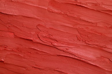 Photo of Texture of bright lipstick as background, top view