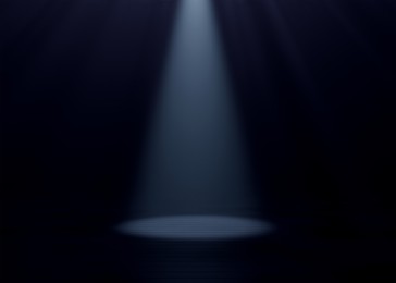 Image of Bright spotlight in dark room. Performance equipment