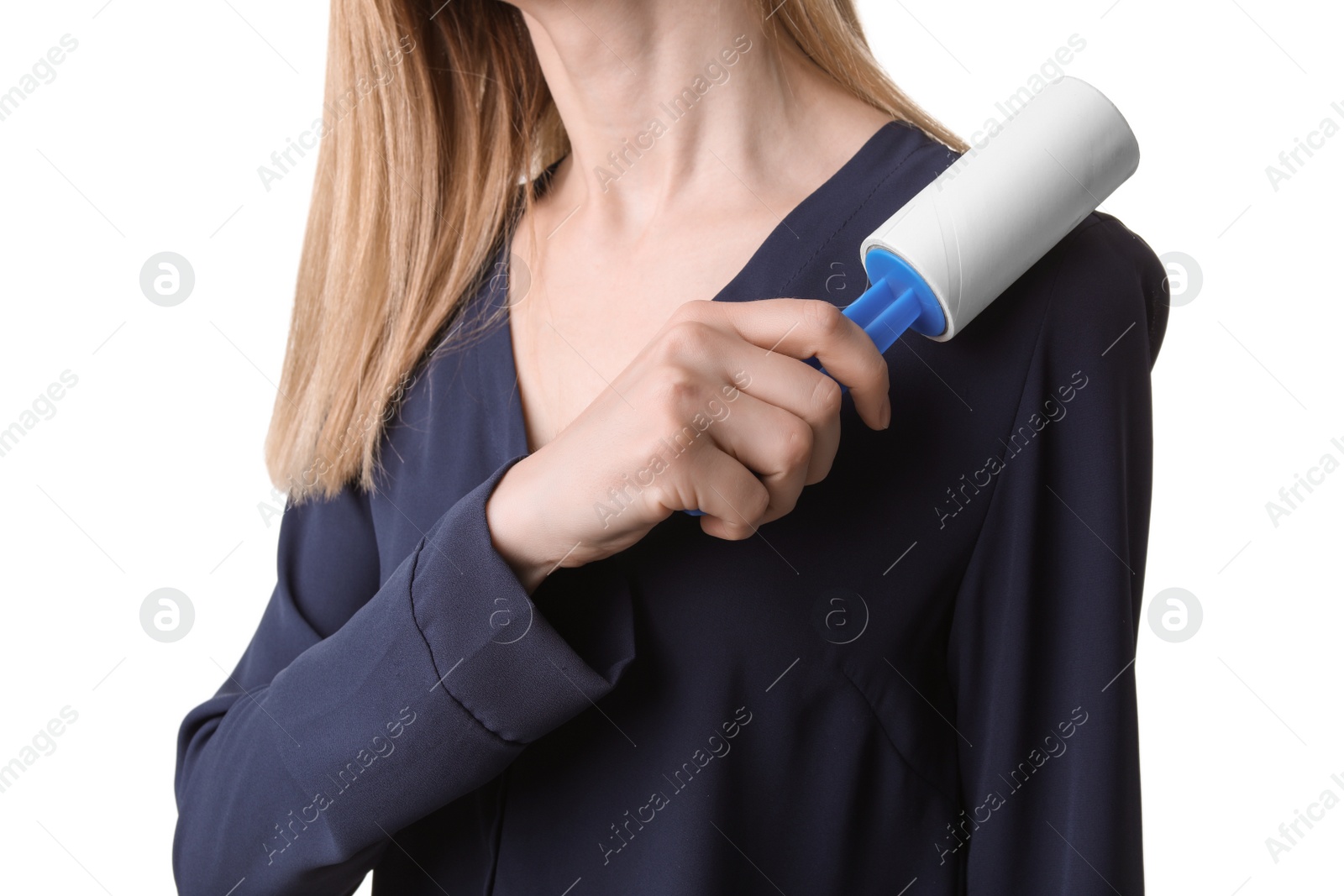 Photo of Young woman cleaning blouse with lint roller on white background