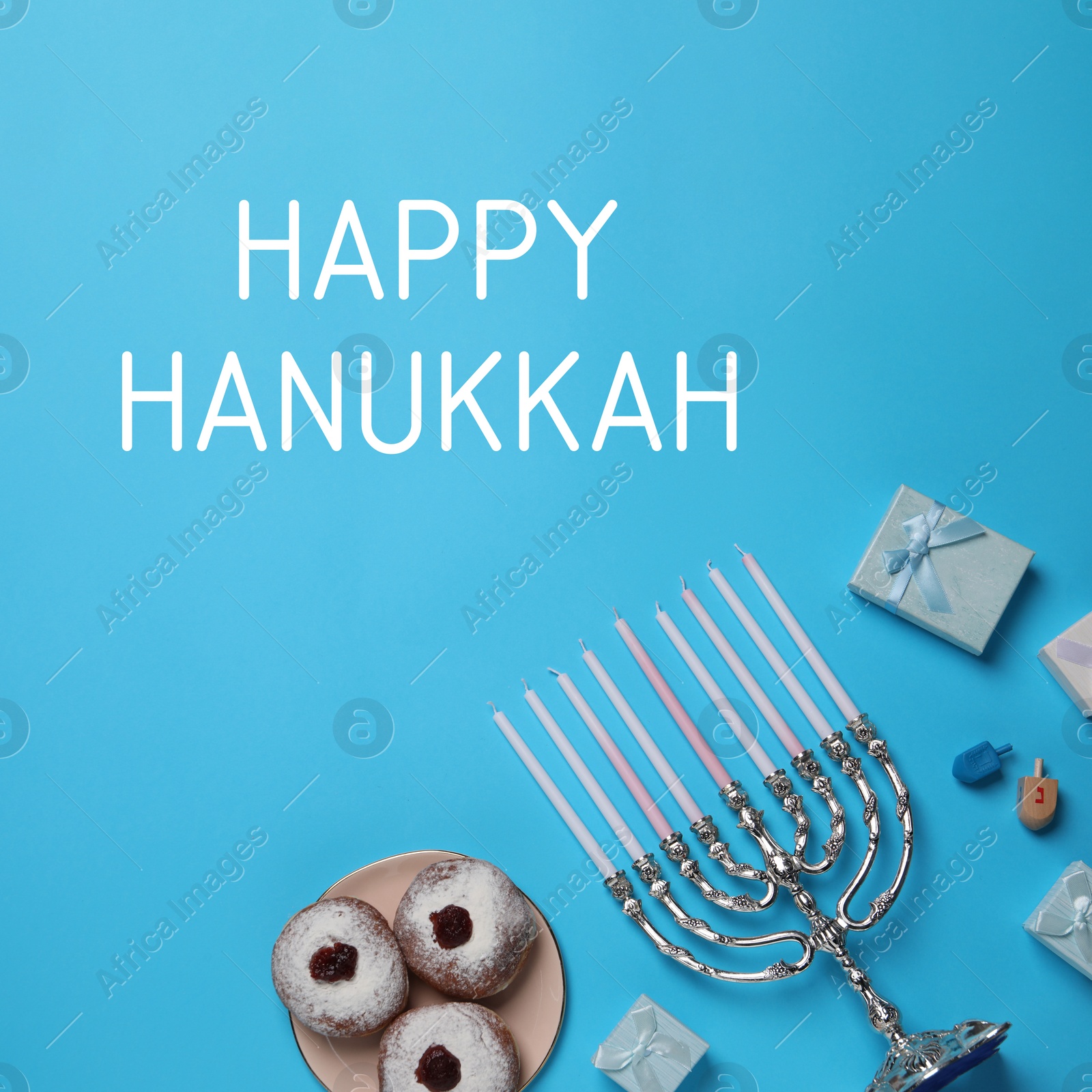 Image of Happy Hanukkah. Menorah, donuts, dreidels and gifts on light blue background, flat lay