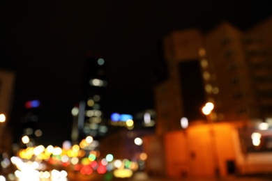 Photo of Blurred view of night cityscape with bokeh effect