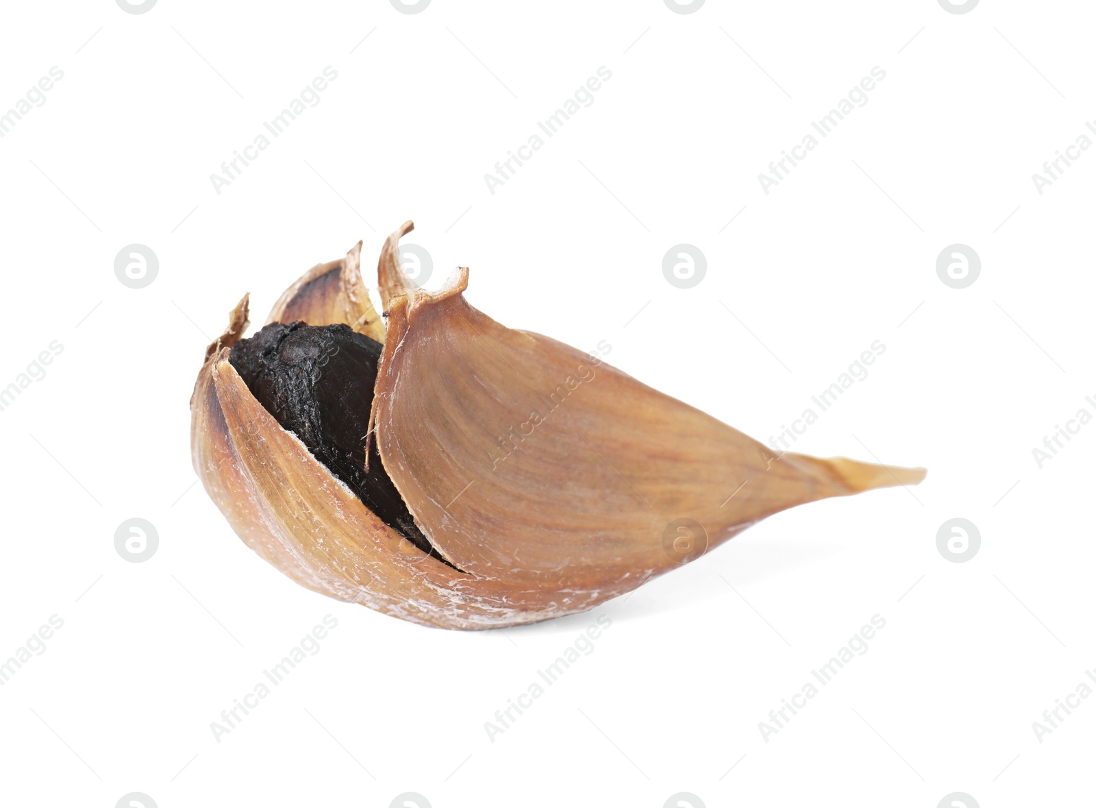 Photo of Unpeeled clove of aged black garlic on white background