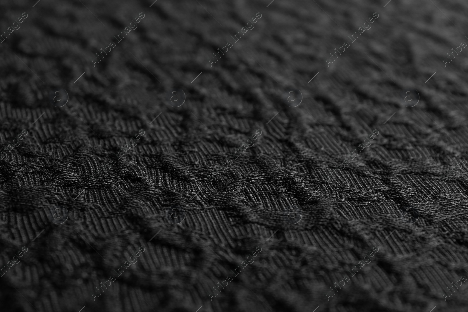 Photo of Textured dark fabric as background, closeup view