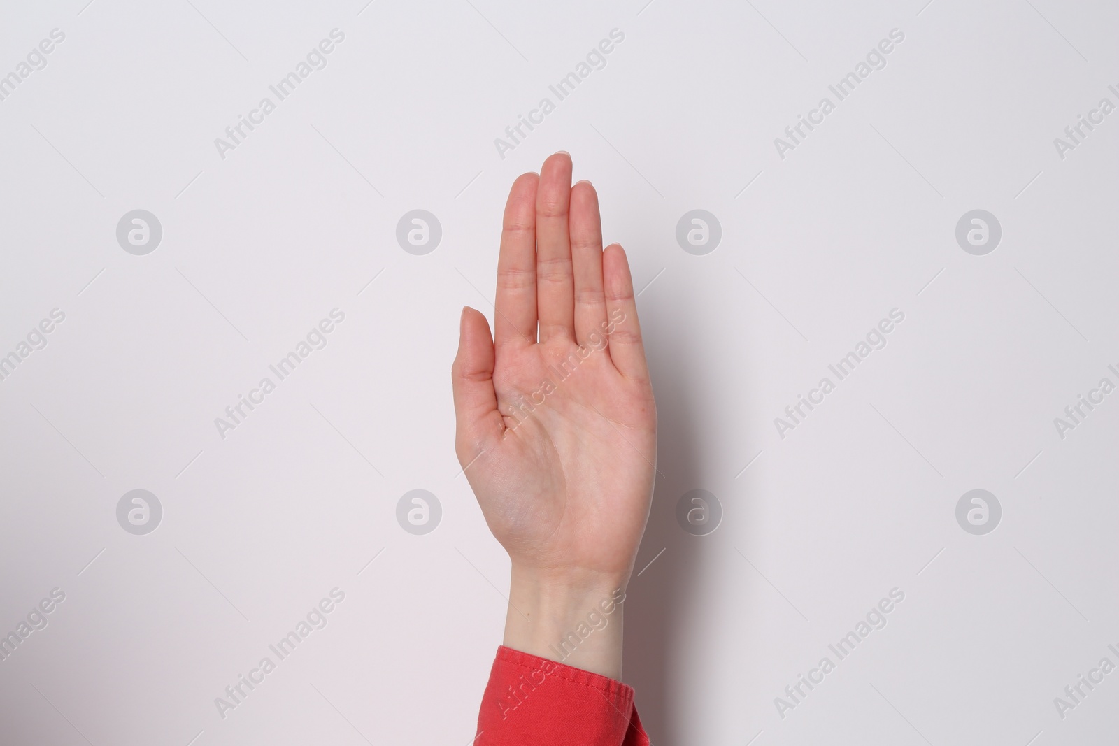 Photo of Woman showing open palm on white background, closeup