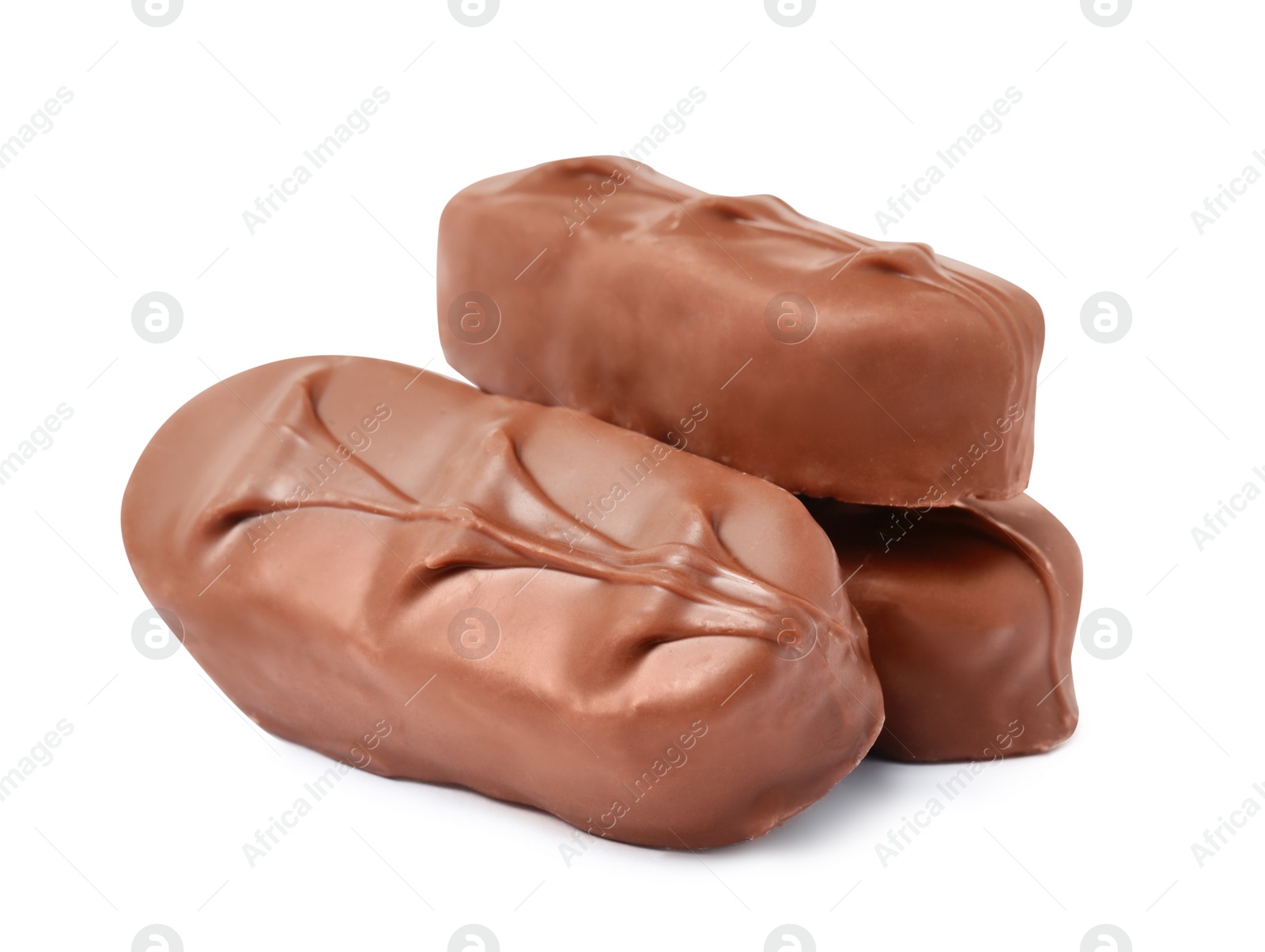 Photo of Delicious milk chocolate candy bars on white background