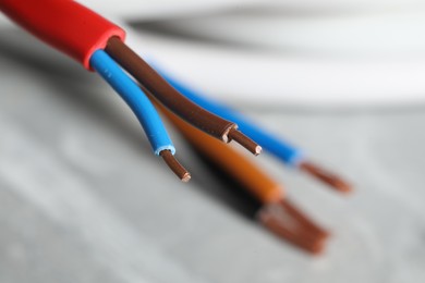 Photo of Colorful electrical wire on blurred background, closeup