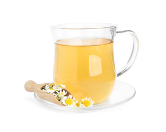 Photo of Fresh chamomile tea and dry flowers in scoop isolated on white