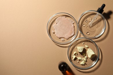 Photo of Flat lay composition with Petri dishes on beige background. Space for text