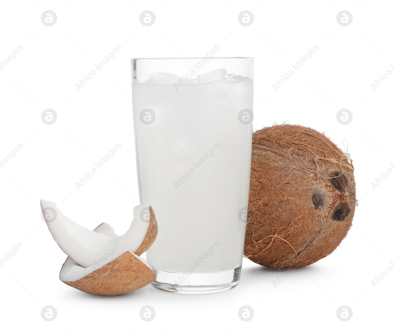 Photo of Glass of coconut water, ice cubes and nuts isolated on white