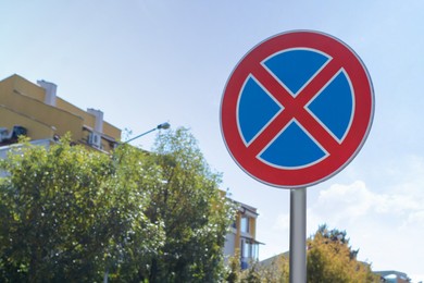 Road sign No Stopping outdoors on sunny day, space for text