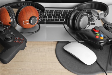 Photo of Composition with computer mouse and gaming gear on table