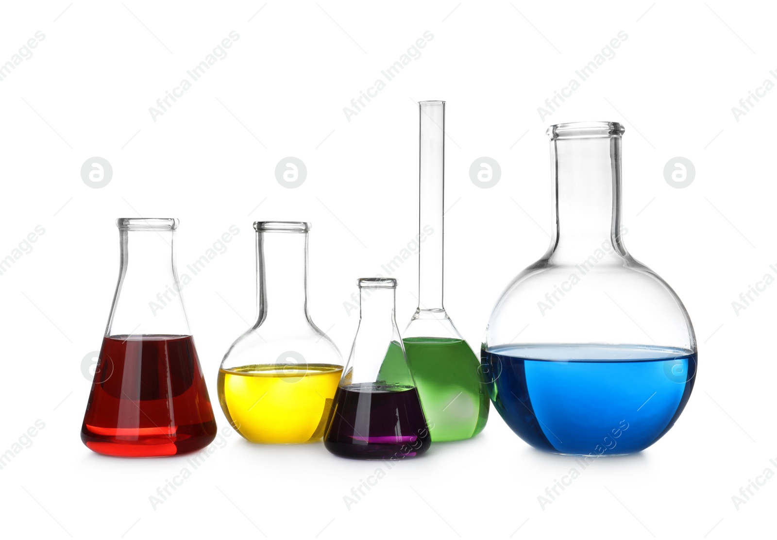 Photo of Laboratory glassware with color liquids on white background