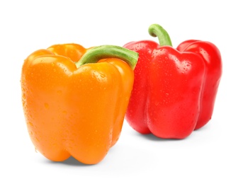 Photo of Wet ripe bell peppers on white background