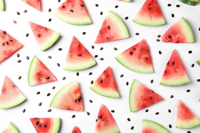 Photo of Flat lay composition with slices and seeds of watermelon on white background