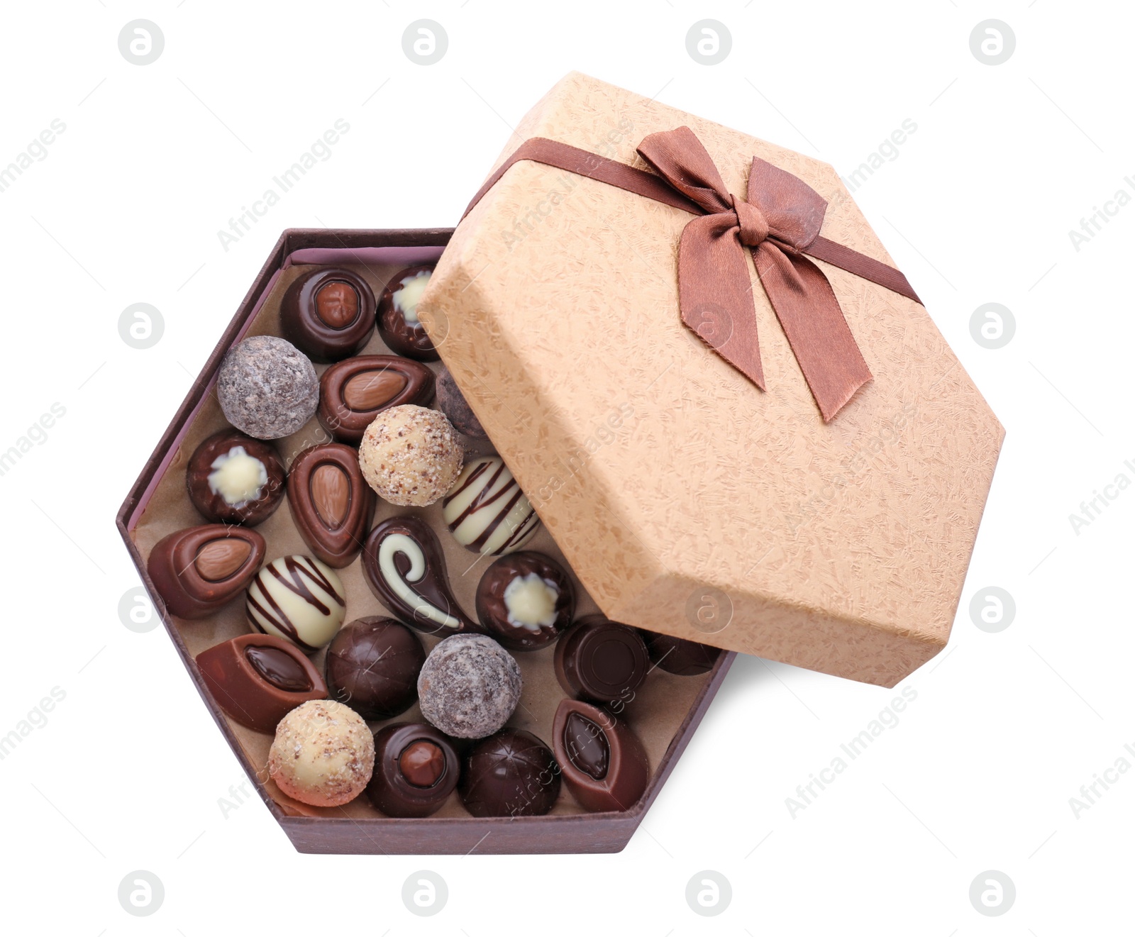 Photo of Box of delicious chocolate candies isolated on white, top view