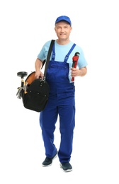 Photo of Mature plumber with pipe wrench and tool bag on white background