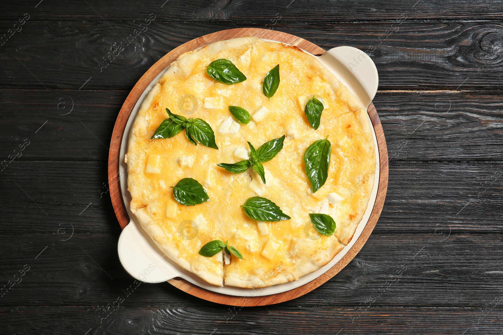 Photo of Fresh tasty homemade pizza on wooden background, top view