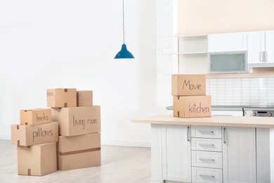 Photo of Cardboard boxes on table indoors. Moving day