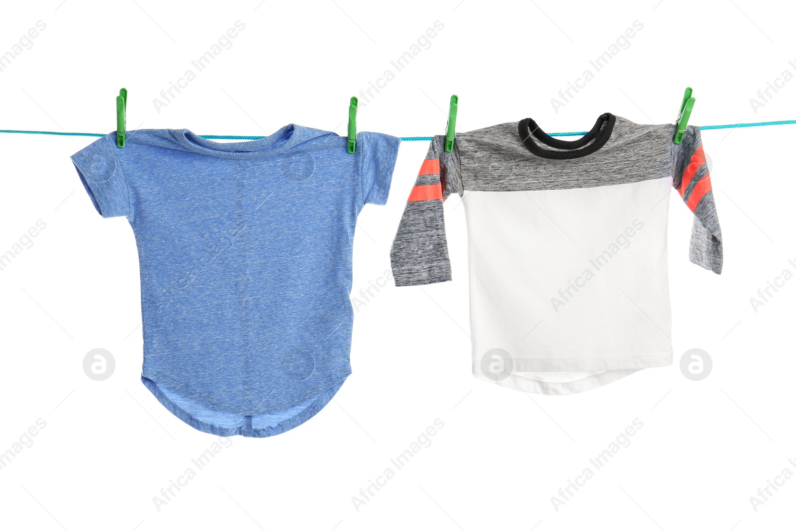 Photo of Child clothes on laundry line against white background