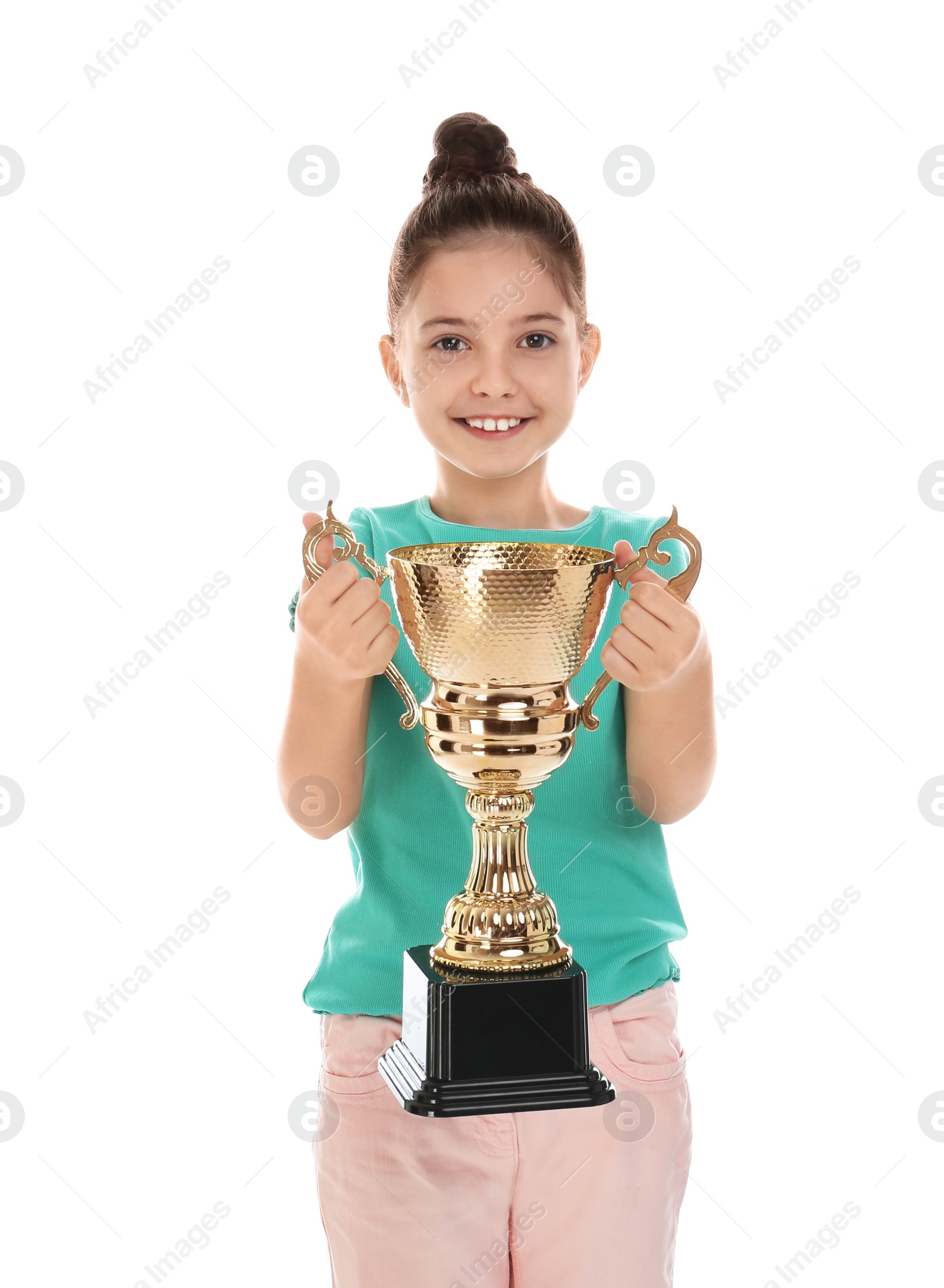 Photo of Happy girl with golden winning cup isolated on white