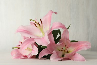 Beautiful pink lily flowers on white table