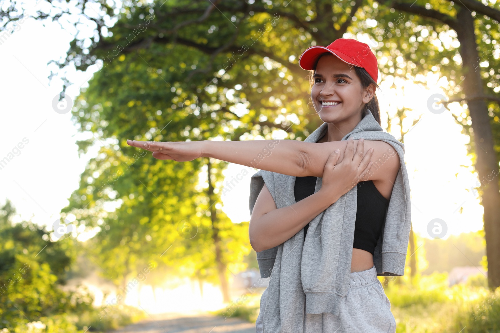 Photo of Young woman doing morning exercise in park