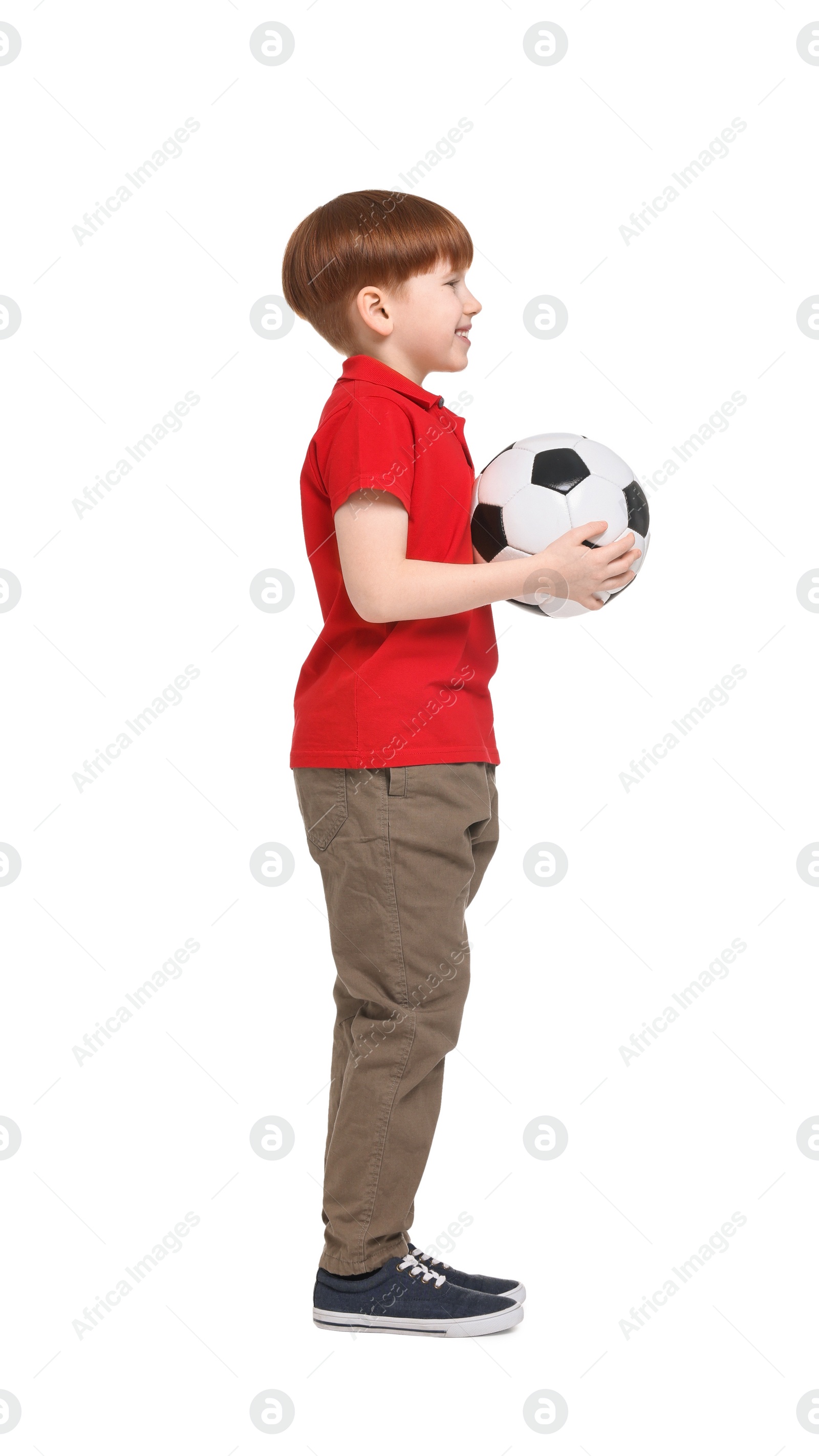 Photo of Little boy with soccer ball on white background