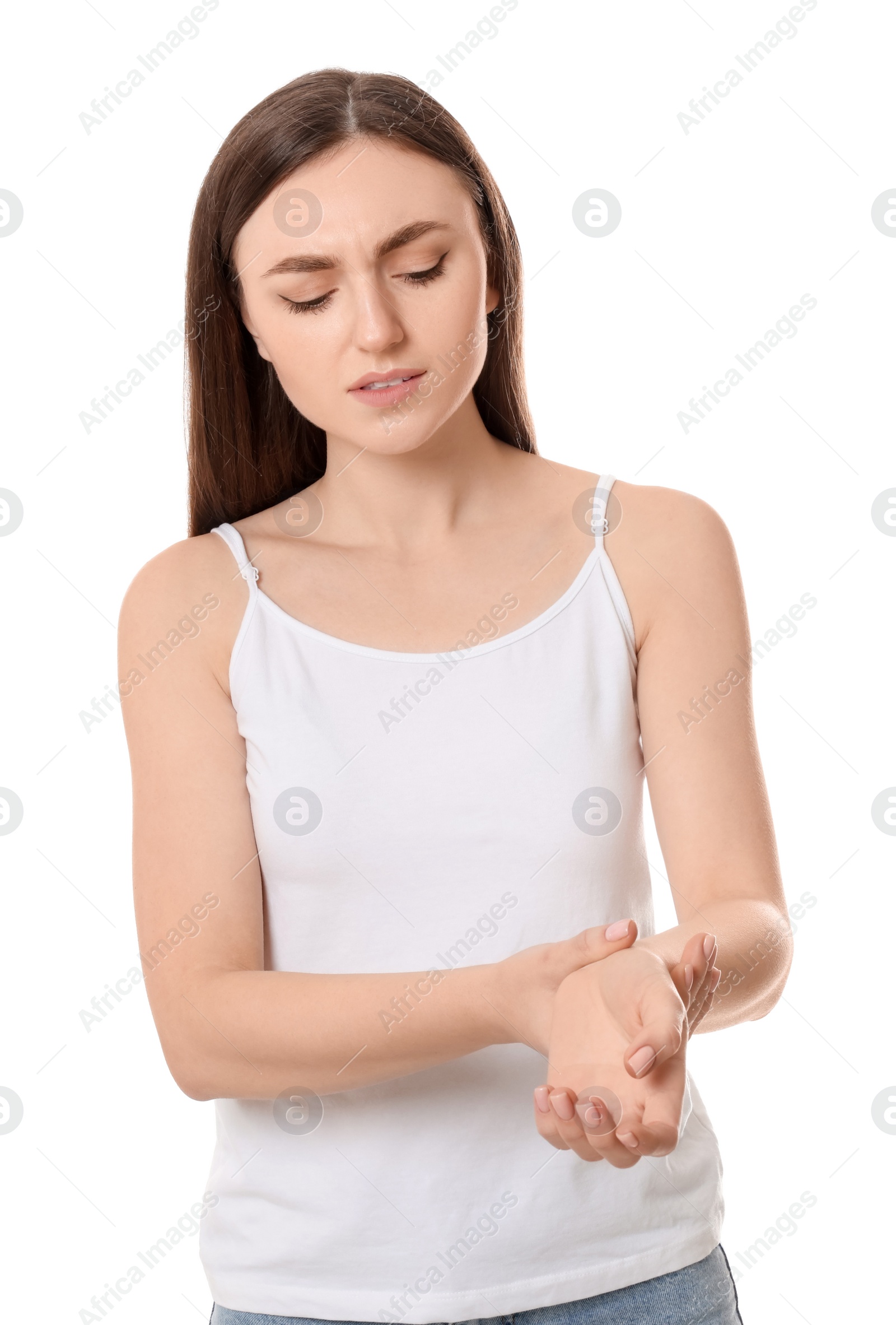 Photo of Young woman suffering from pain in her hand on white background. Arthritis symptoms