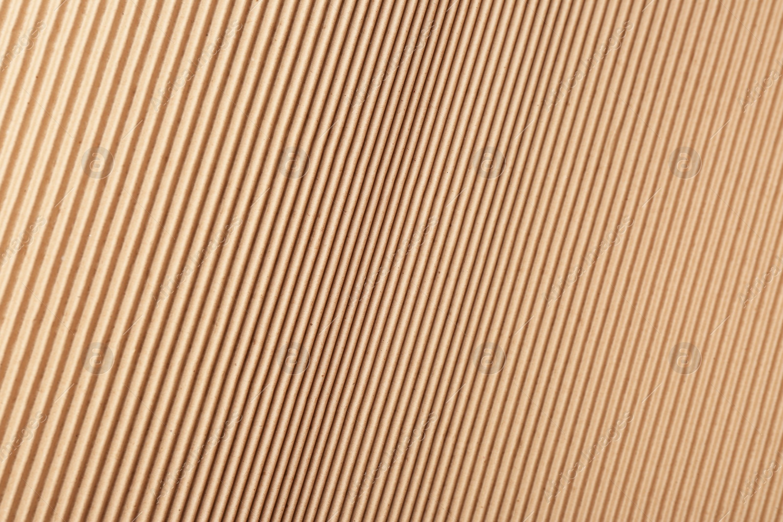 Photo of Corrugated cardboard surface as background, top view. Recyclable material