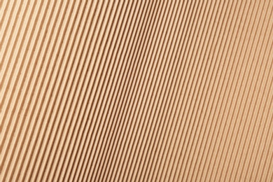 Photo of Corrugated cardboard surface as background, top view. Recyclable material