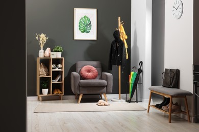 Modern hallway interior with stylish furniture and decorative elements