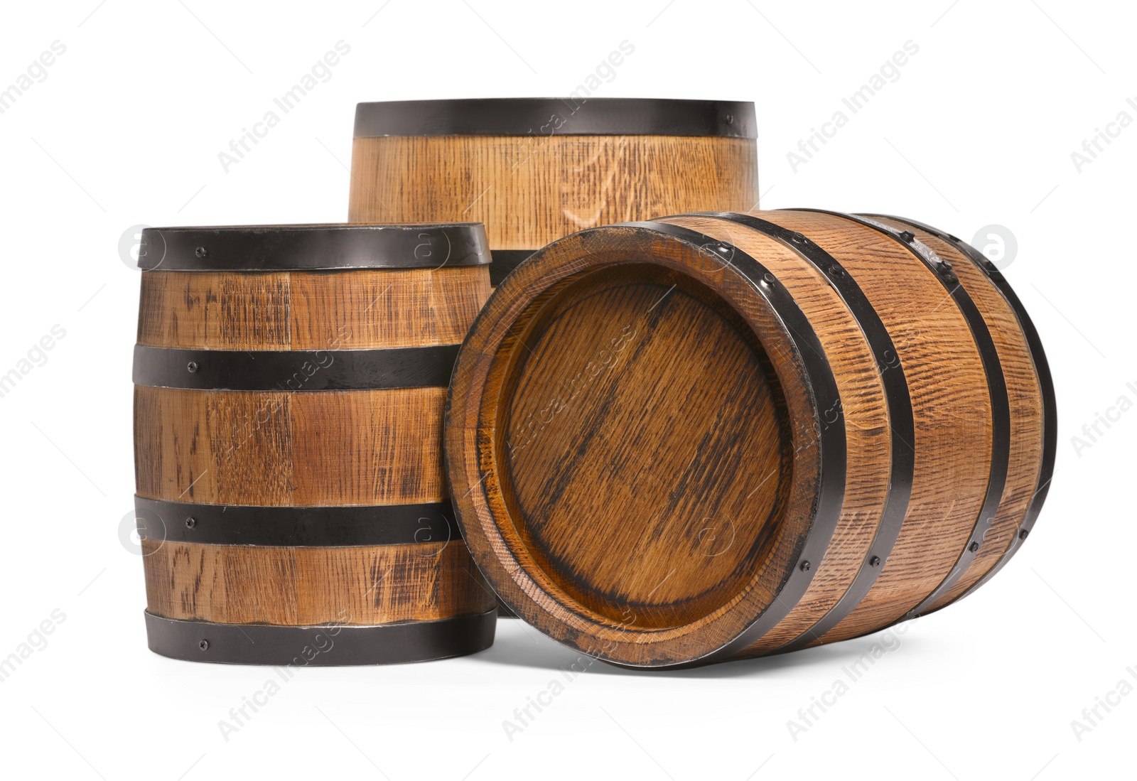 Photo of Three traditional wooden barrels on white background