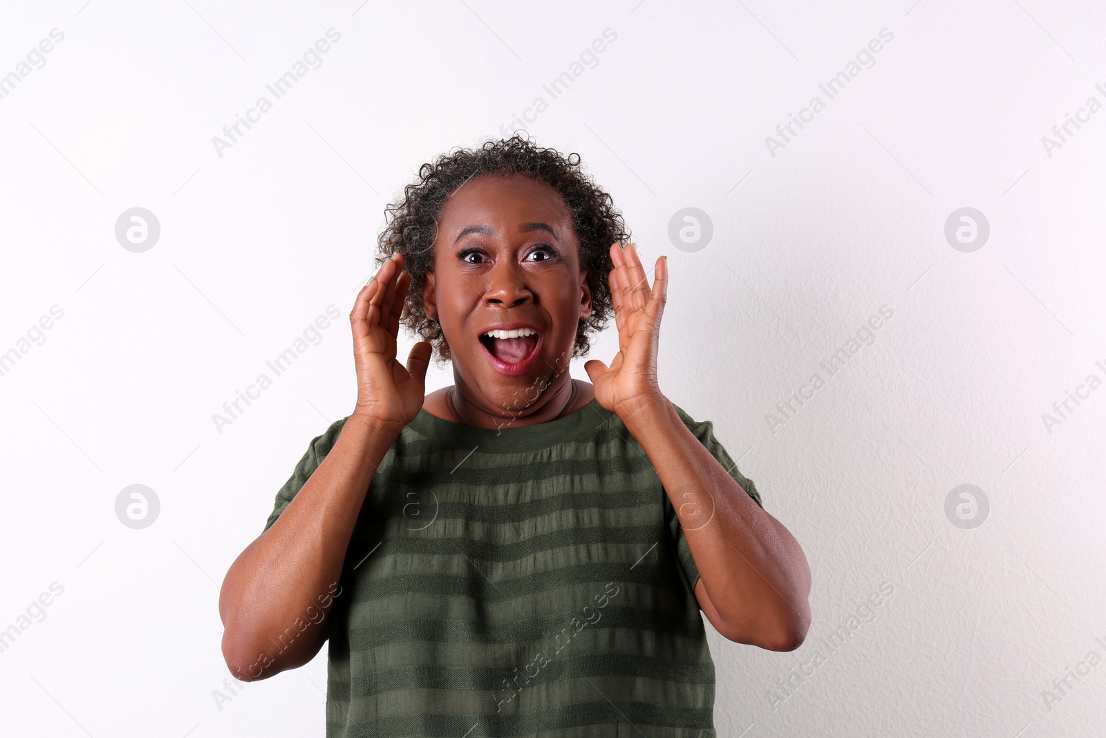 Photo of Portrait of happy African-American woman on white background