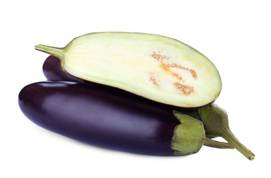 Photo of Cut and whole fresh ripe eggplants on white background