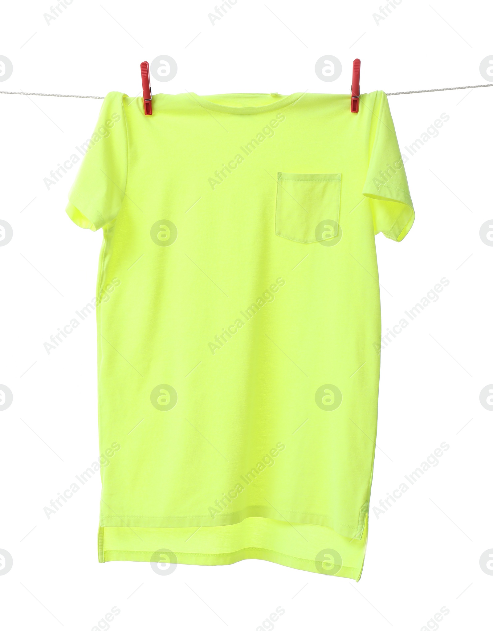 Photo of One green t-shirt drying on washing line isolated on white