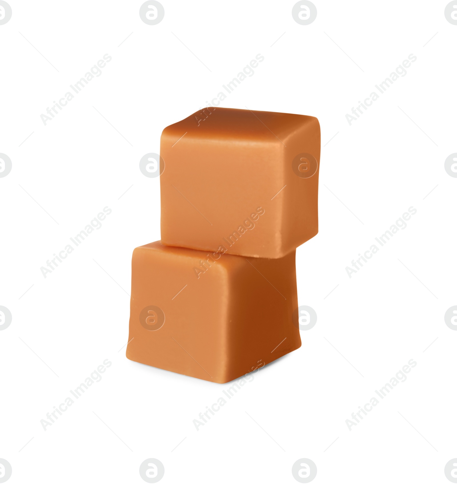 Photo of Two sweet caramel candies on white background