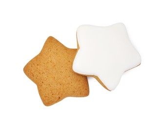 Photo of Tasty star shaped Christmas cookies with icing isolated on white, top view