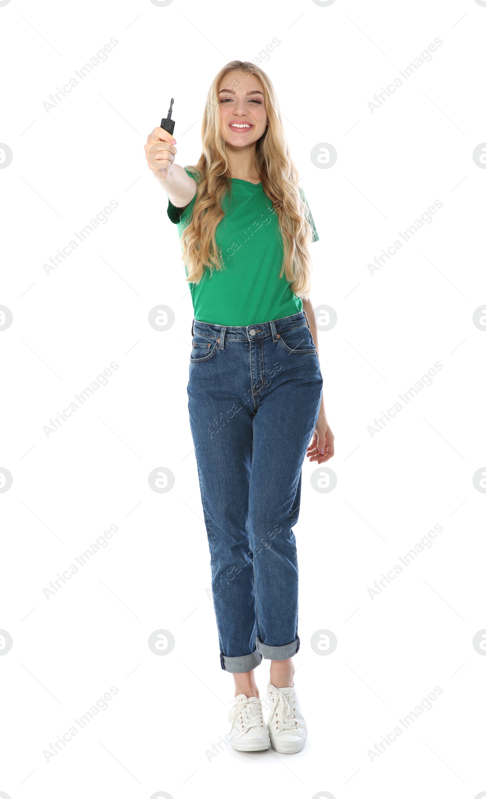 Photo of Happy young woman with car key on white background. Getting driving license