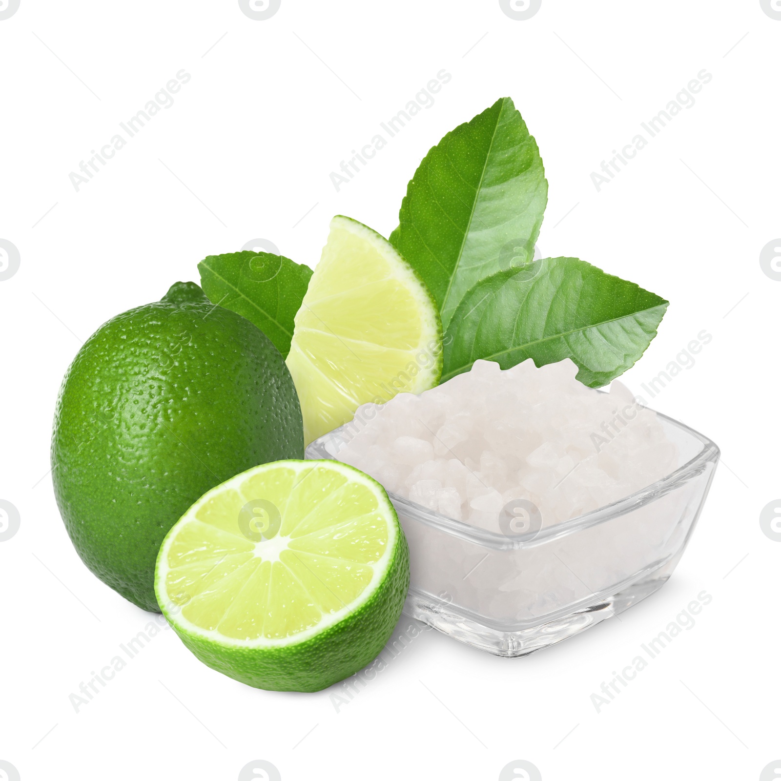 Image of Limes and salt isolated on white. Margarita cocktail ingredients