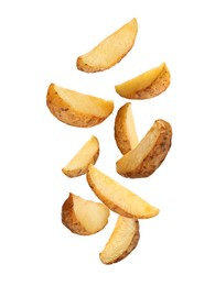 Image of Tasty baked potatoes falling on white background