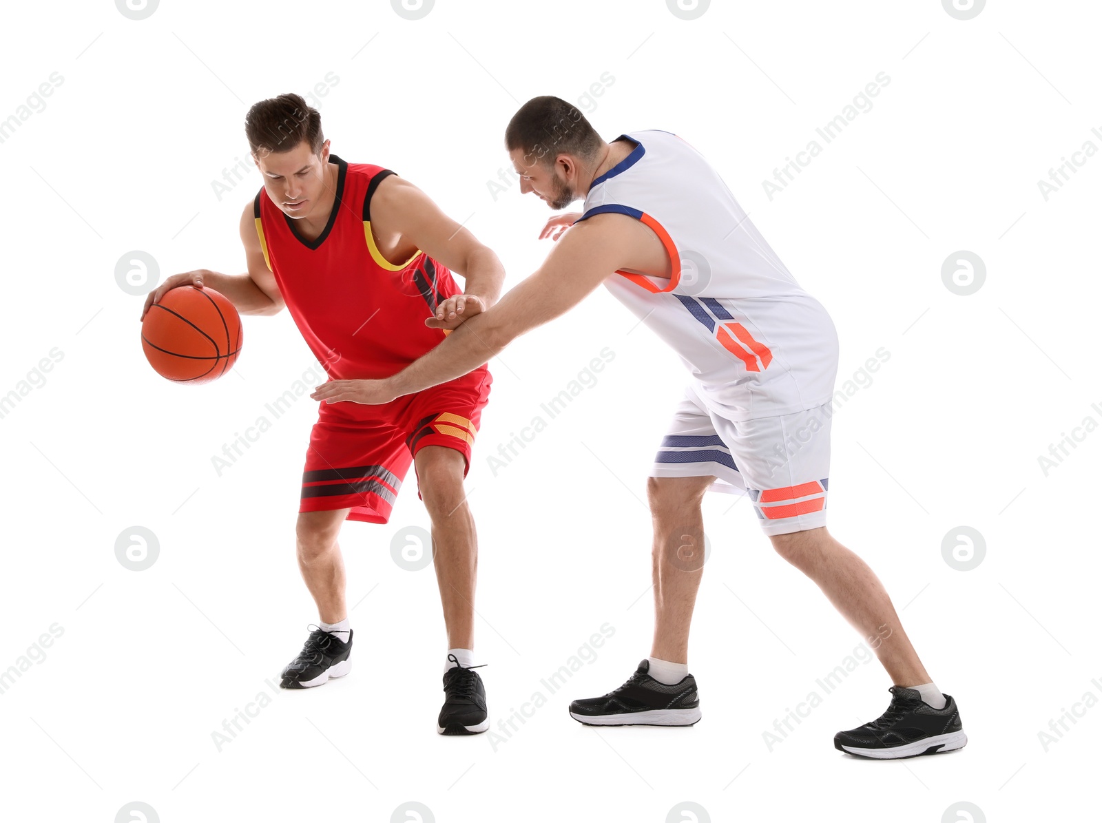 Photo of Professional sportsmen playing basketball on white background
