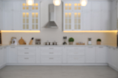 Photo of Blurred view of modern stylish kitchen interior