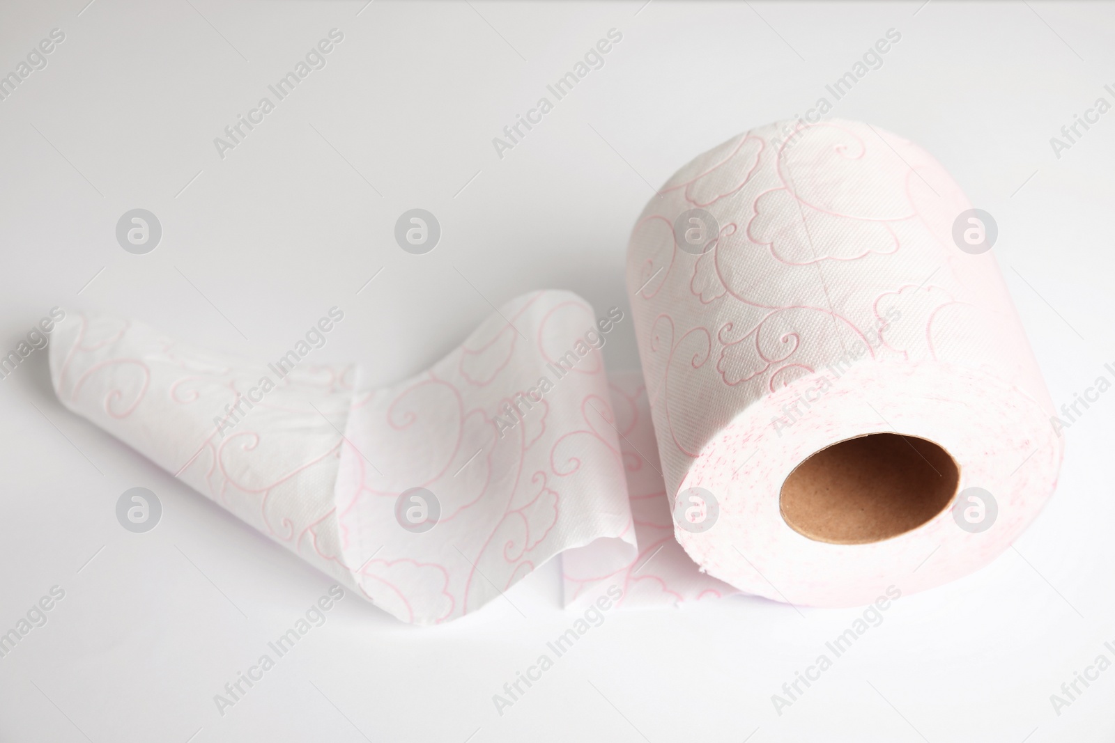 Photo of Toilet paper roll on white background. Personal hygiene
