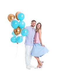 Young couple with air balloons on white background