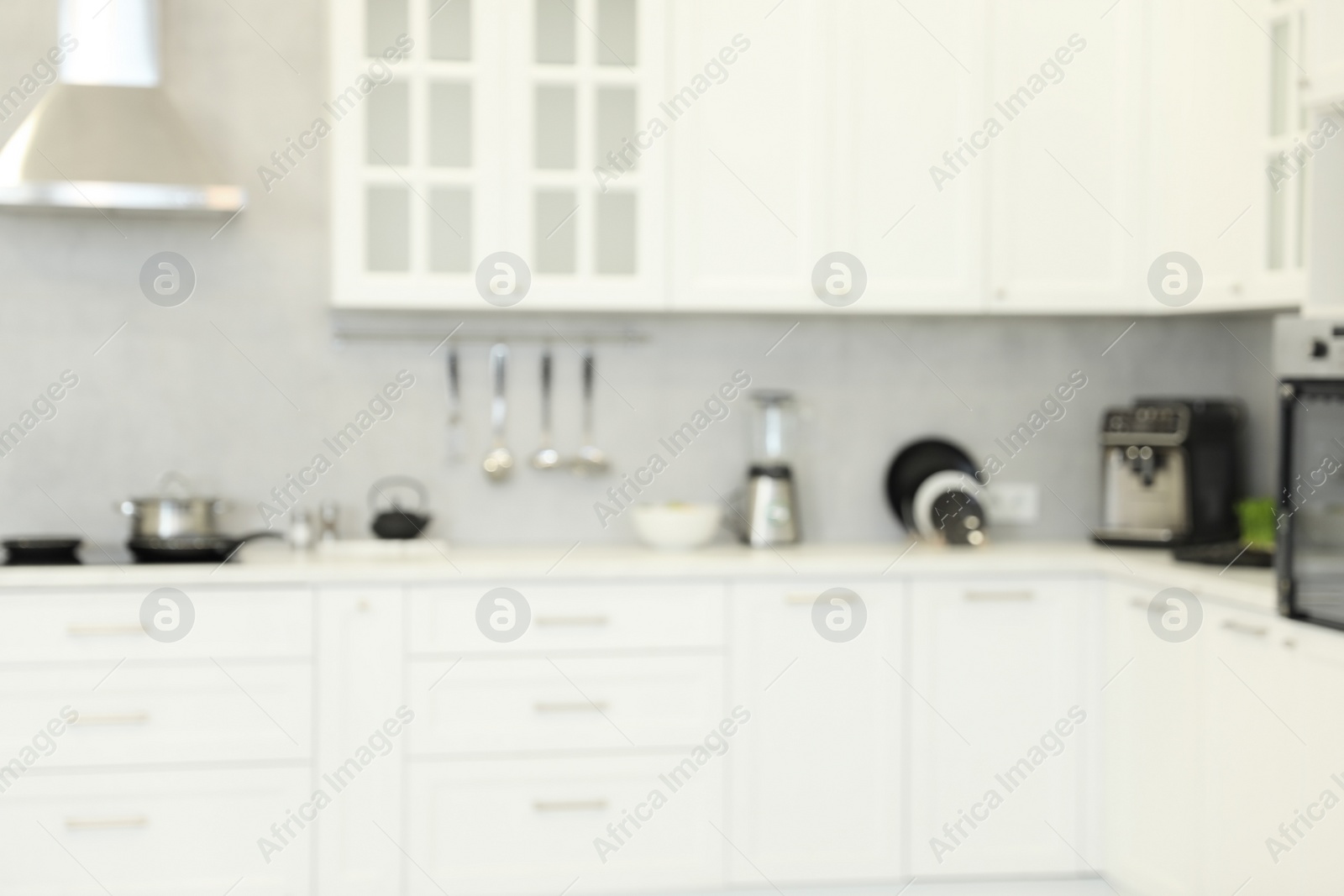 Photo of Blurred view of modern kitchen. Interior design