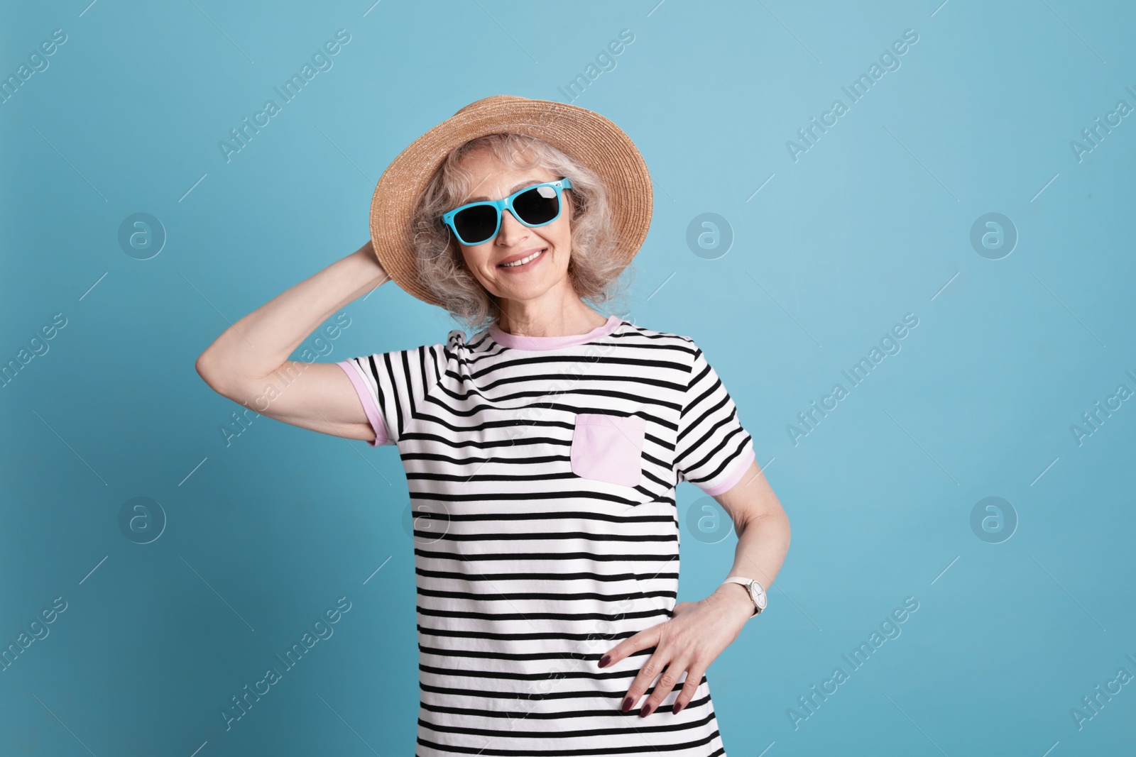 Photo of Portrait of mature woman in hipster outfit on color background