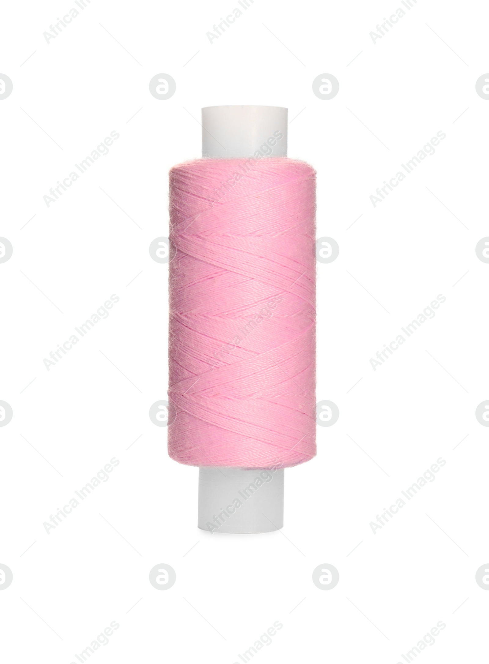 Photo of Spool of pink sewing thread isolated on white