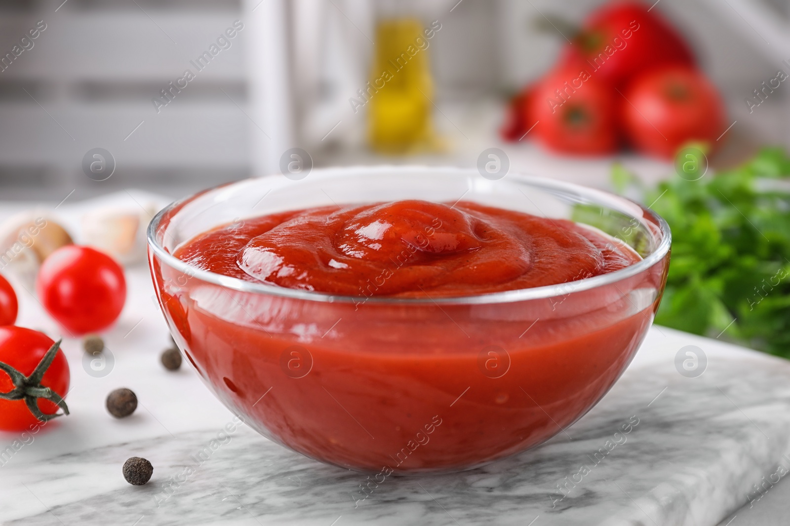 Photo of Delicious tomato sauce on light board, closeup