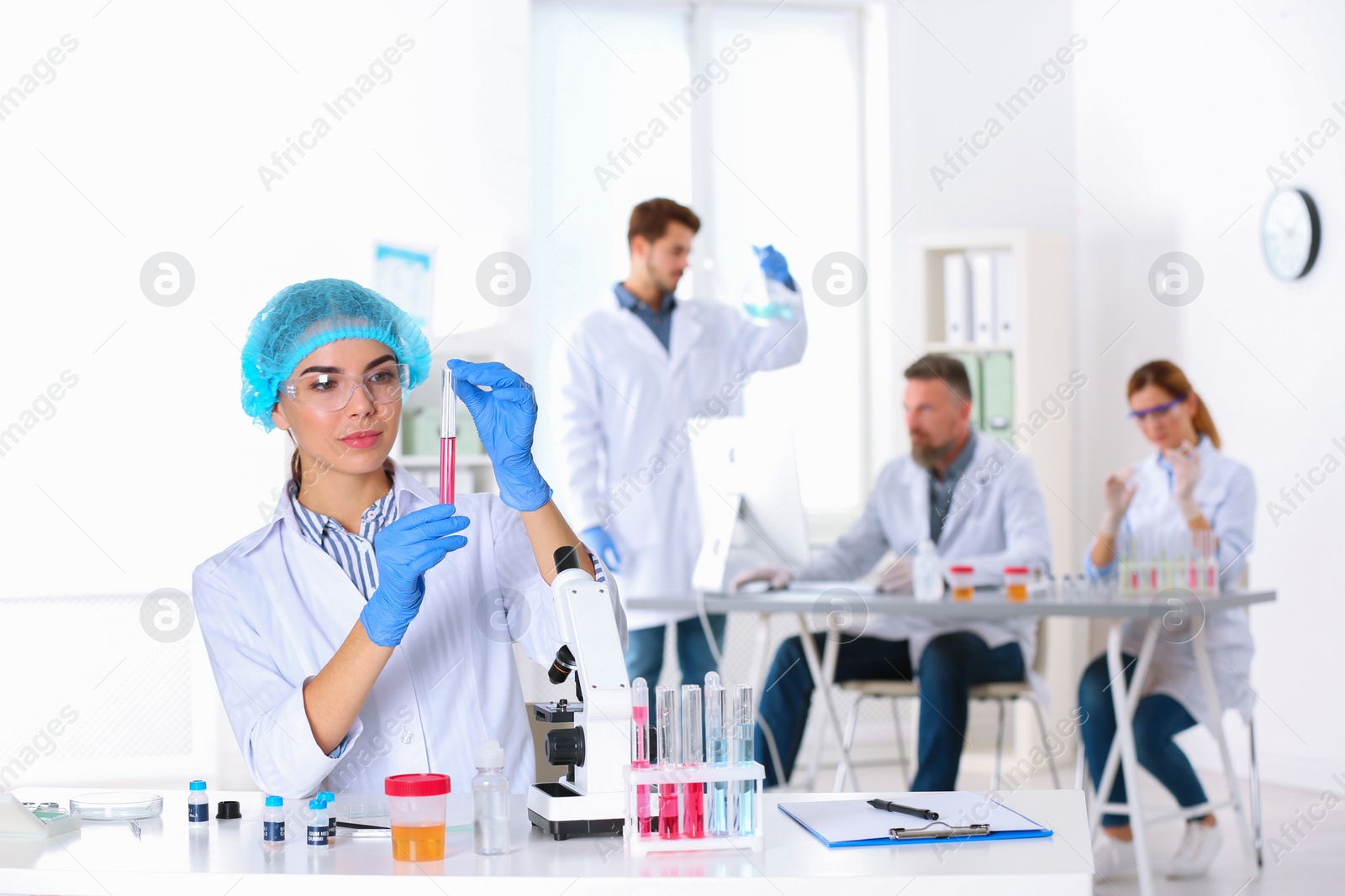 Photo of Female scientist working at table in laboratory, space for text. Research and analysis