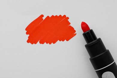Photo of Stroke drawn with orange marker and highlighter isolated on white, top view
